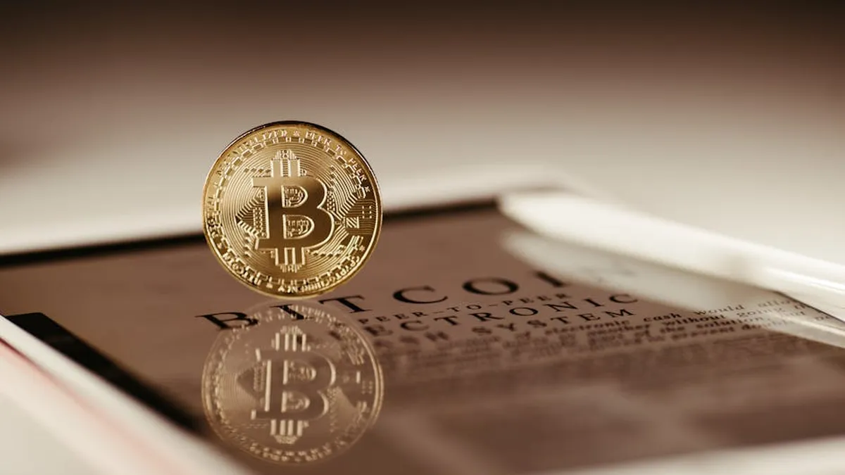 A floating Bitcoin reflecting on a glossy surface symbolizing cryptocurrency trading.