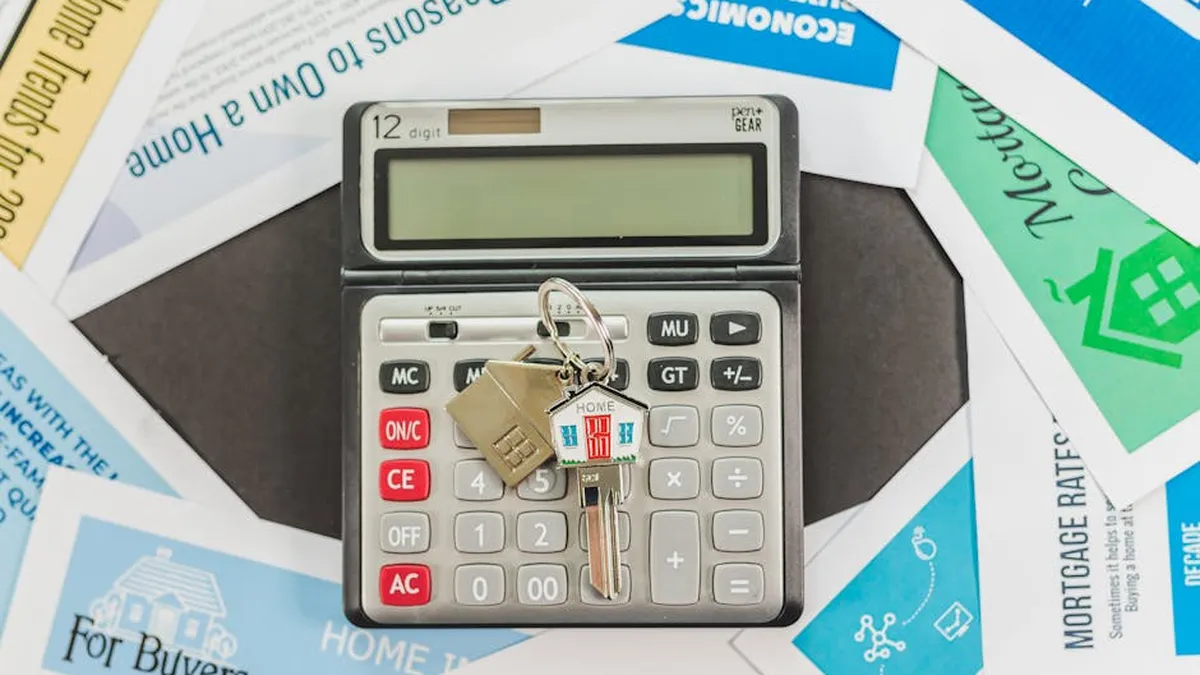 Calculator with keys and financial documents