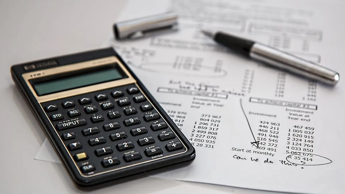 Close-up of financial documents with calculator