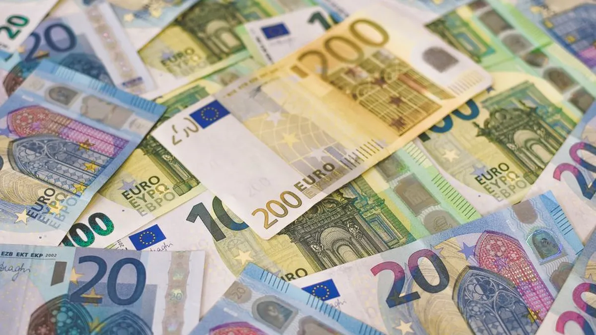 Colorful assortment of Euro banknotes in various denominations, signifying wealth and finance.
