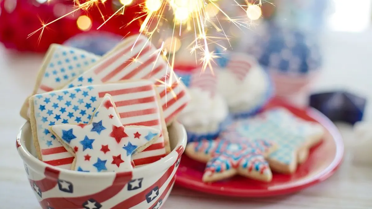 Delicious American flag-themed cookies with sparklers for a Fourth of July celebration.
