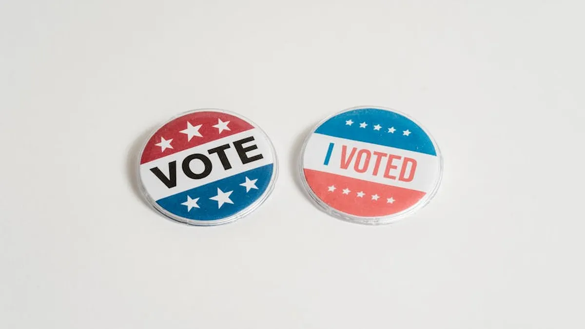 Red, white, and blue political buttons with 'Vote' and 'I Voted' text for election and civic engagement themes.