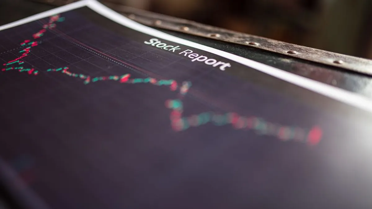 Detailed stock report showing market trends on paper charts.