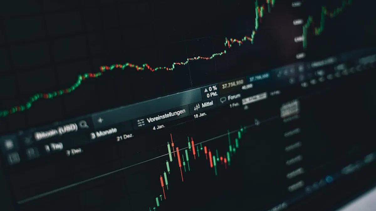 Close-up of a digital market analysis display showing Bitcoin and cryptocurrency price trends.