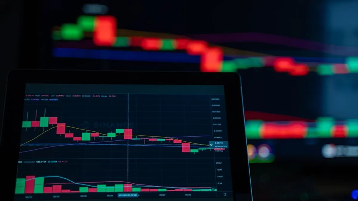 A close-up view of cryptocurrency trading charts showing a bearish trend in a digital market on a computer screen.